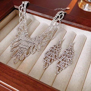 Luxury silver rhinestone necklace and drop earring set in a beige velvet jewelry box