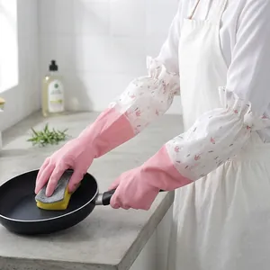 Waterproof fleece-lined kitchen gloves with floral sleeves shown while washing a pot