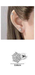 Close-up of snowflake stud earrings with crystals and screw back detail in silver finish