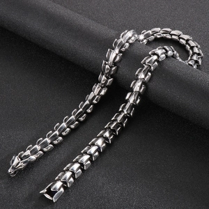 Close-up of a punk style dragon bone link bracelet in polished stainless steel for men