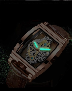Luminous green hands and markers on hollow mechanical watch dial with rose gold case