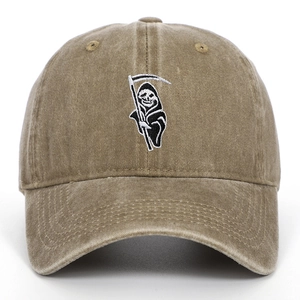 Close-up of Grim Reaper embroidery on a vintage washed cotton baseball cap