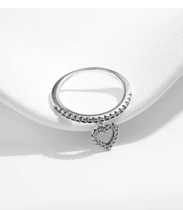 Detail view of S925 sterling silver ring with sparkling heart pendant and micro-pave diamonds