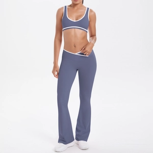 Detail of cross-waist yoga pants with white contrast piping and V-shape tummy control design