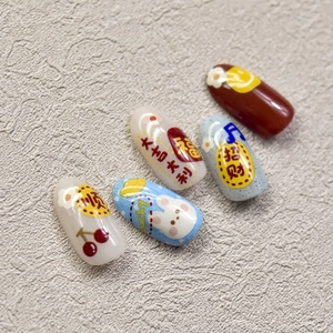 Macro view of embossed nail art stickers with rabbit patterns and Chinese lucky charms