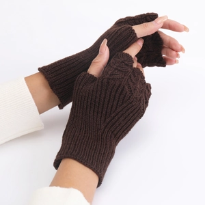 Detail of dark brown knitted fingerless gloves with vertical ribbed texture for winter
