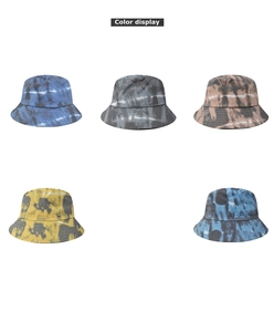 Detail display of five tie-dye bucket hats in blue, grey, tan, yellow, and navy textures