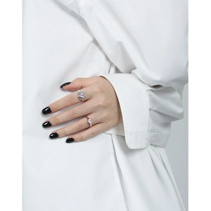 S925 sterling silver heart ring set with pink zircon on hand close-up photography