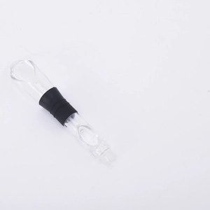 Close-up of a clear plastic wine aerator with a black rubber seal on a white background