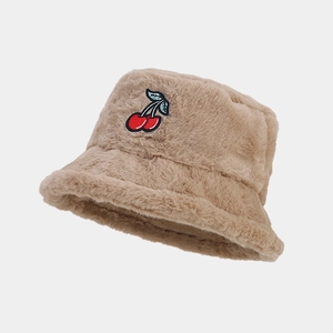Close-up of soft khaki plush bucket hat with red cherry embroidery detail
