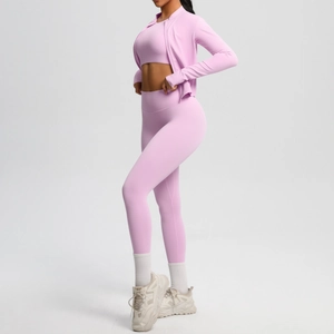 Detailed side view of tight pink yoga set featuring a zipper jacket and leggings