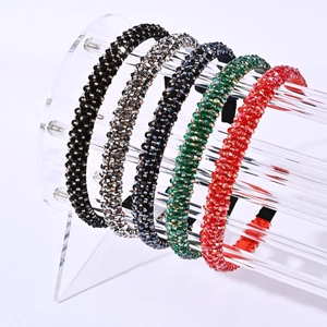 Detailed view of handmade crystal beaded headbands in multiple vibrant colors