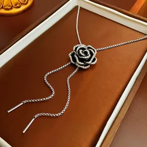 Elegant black camellia flower pendant necklace with rhinestones and long silver chain