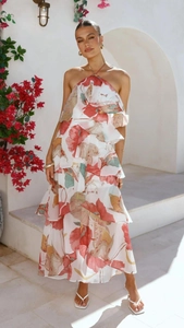 Detail of tiered ruffle hem and floral print on white chiffon off-shoulder long dress