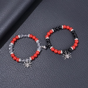 Magnetic spider pendant bracelets for couples featuring red and black beads on leather