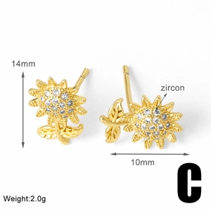Macro view of gold sunflower stud earrings with zircon details and size measurements