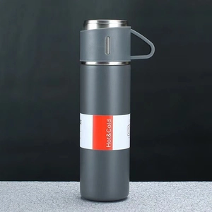 Dunkelgraue matte Edelstahl-Thermoskanne mit Hot & Cold Etikett und Tragegriff