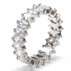 Detailed view of silver eternity ring with oval cut cubic zirconia and prong setting
