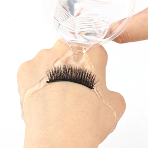 Waterproof test of self-adhesive false eyelashes showing water droplets on black lashes