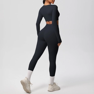 Detail view of high-elasticity dark blue yoga set with long sleeve crop top and leggings