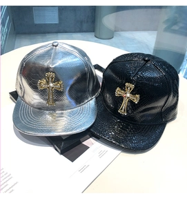Detail shot of PU leather baseball caps with crystal-encrusted metallic cross ornaments