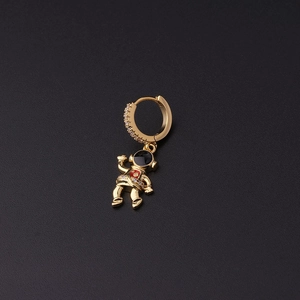 Detailed close-up of a gold-plated astronaut earring with micro-pave cubic zirconia accents