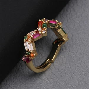 Adjustable gold V-shaped ring with multi-colored pavé zircon stones in a top-down view