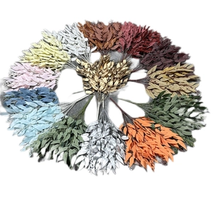 Artificial eucalyptus willow leaves in various colors arranged in a decorative circular display