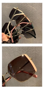 Macro detail of oversized square sunglasses featuring thick frames and golden hinge accents