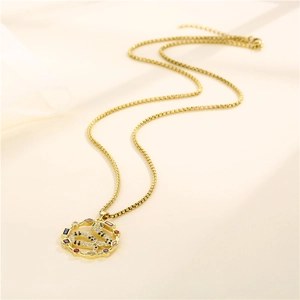 Golden box chain necklace featuring a round pendant with a colorful zircon micro-pave snake