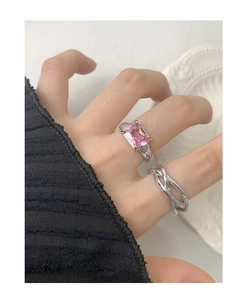 Detailed view of S925 silver ring featuring pink rectangular zircon on model finger