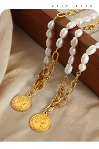 Detail of baroque freshwater pearl necklace with vintage gold coin portraits on silk