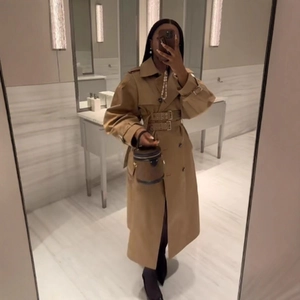 Classic khaki double-breasted long trench coat for women with stylish dual waist belts