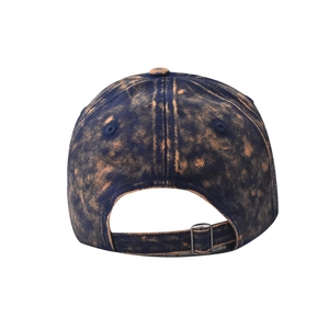 Detail of vintage washed denim baseball cap featuring adjustable metal buckle and strap
