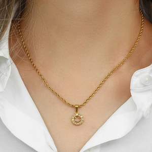 Close-up of 18K gold plated smiley face pendant with crystals on a twist chain necklace