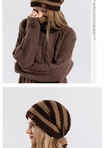 Detail showing the brown knit beanie and matching scarf set with mountain leather patch