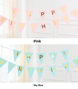Detail of pink and blue Happy Birthday banners with elegant gold foil lettering
