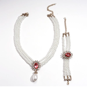 Baroque multi-layer pearl necklace and bracelet set with red gemstones and gold accents