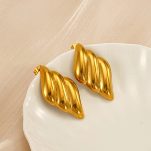 Elegant 18K gold-plated stainless steel twisted wing earrings on white ceramic