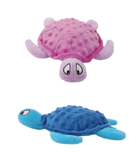 Close-up of pink and blue plush turtle dog toys showing soft textured shell and stitching