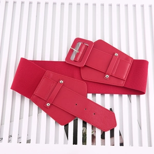 Detail of red elastic waist belt featuring smooth faux leather patches and silver rivets