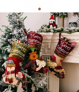 Detailed view of Christmas stockings featuring Santa, reindeer, and snowman designs