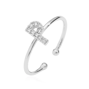 Detailed close-up of a silver letter B ring featuring zircon pavé and an open band design