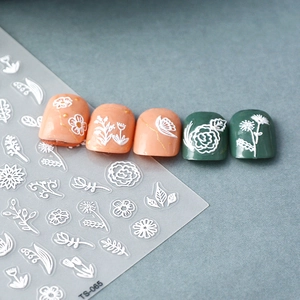 3D embossed white floral nail stickers featuring daisy and rose designs for nail art decoration