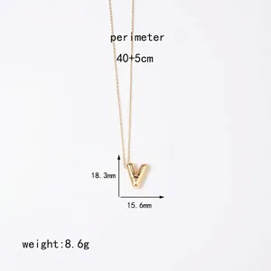Detailed view of gold letter V pendant with 40cm chain and size measurements