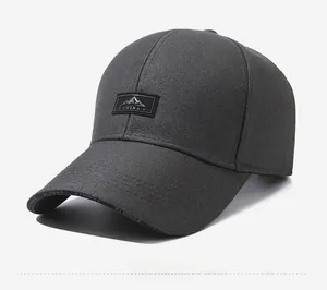 Detailed side view of a dark grey cotton baseball cap with China peak embroidery
