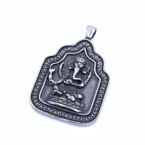 Retro stainless steel Ganesha pendant necklace with embossed relief design on white background