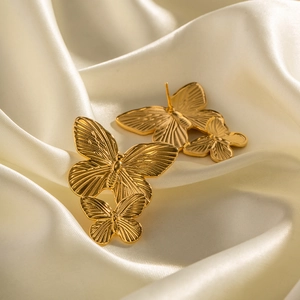 French vintage style golden butterfly earrings crafted in stainless steel on silk