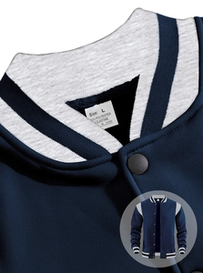 Close-up of ribbed collar and high-quality twill fabric on navy varsity jacket