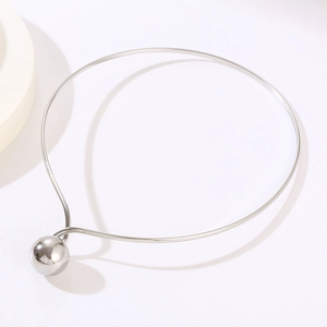 Polished silver stainless steel torque necklace with large spherical pendant detail